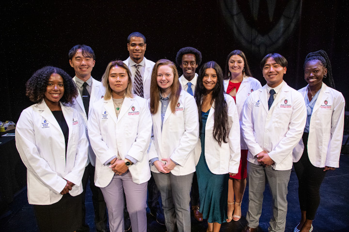 Nia Foster and fellow first-year students at the white coat ceremony