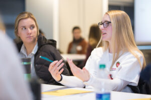 Nursing student having an academic discussion with peers
