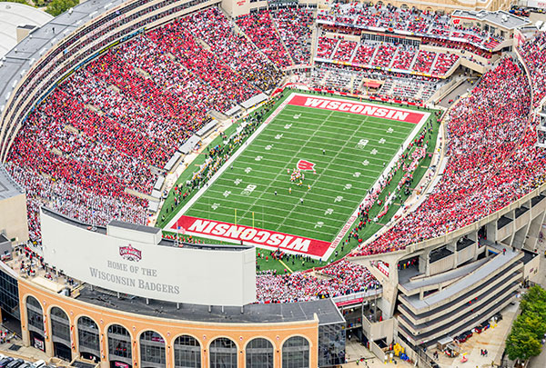 Camp Randall stadium filled with Badgers dressed in red and white