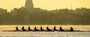 A rowing team practicing on a Madison lake in early morning