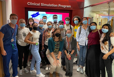 MSTP Summer Scholars group in front of the Clinical Simulation Center entrance