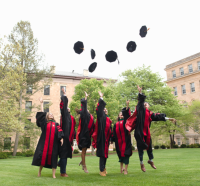 UW School of Medicine and Public Health graduates throw their hats in the air