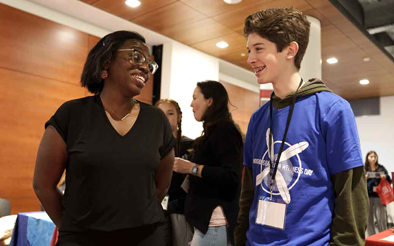 Dobbie Stucki talks to student Dylan Wilson