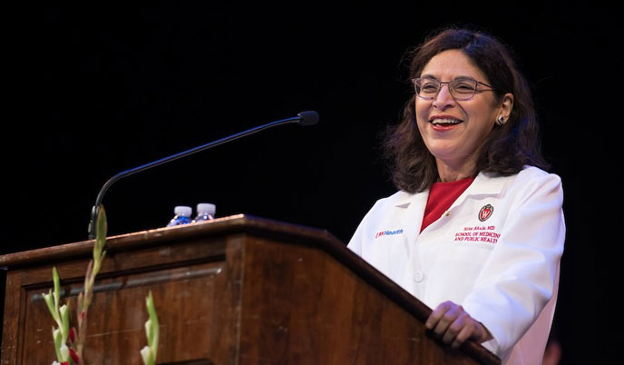 Dean Ahuja at the podium during the White Coat Ceremony
