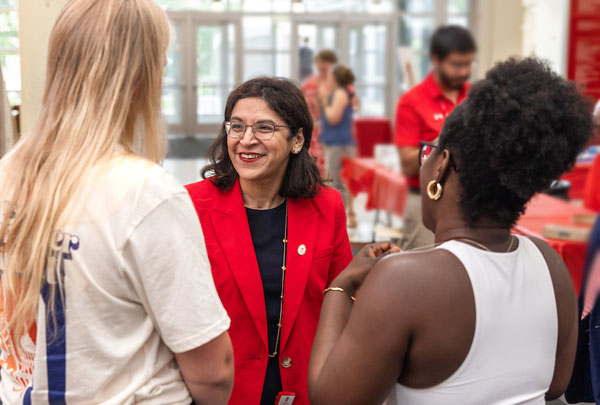 Dean Ahuja talking with people at the Wisco Welcome event