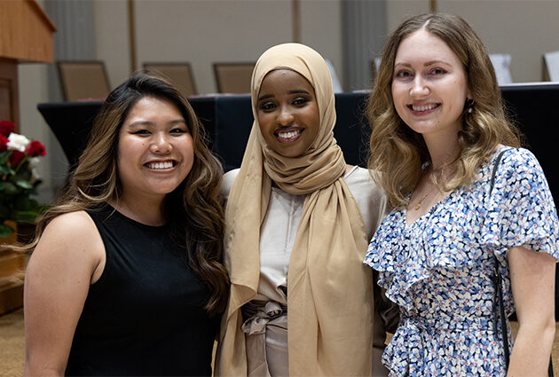 A group of women posing together for a photo