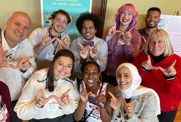 Smiling group of students and faculty