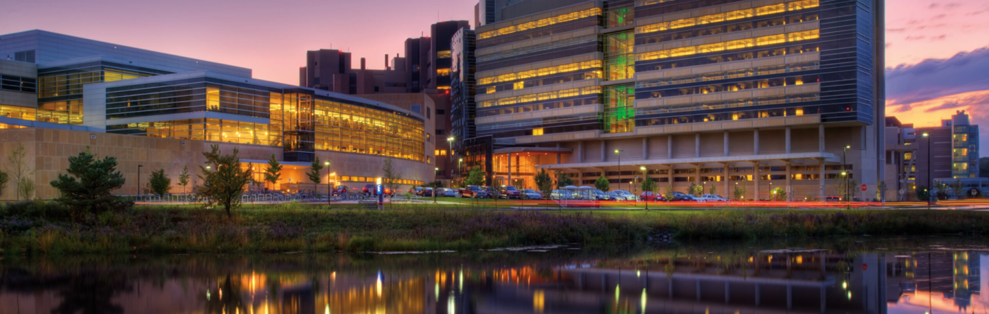 The Health Science Learning Center with lights on at night