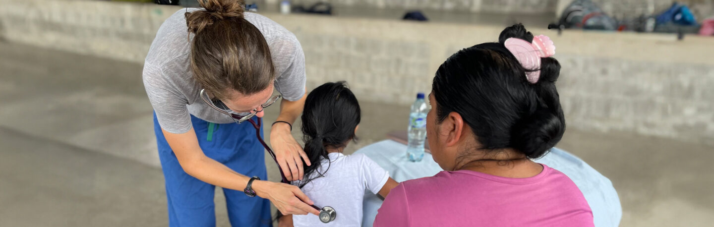 A student providing medical services to a child