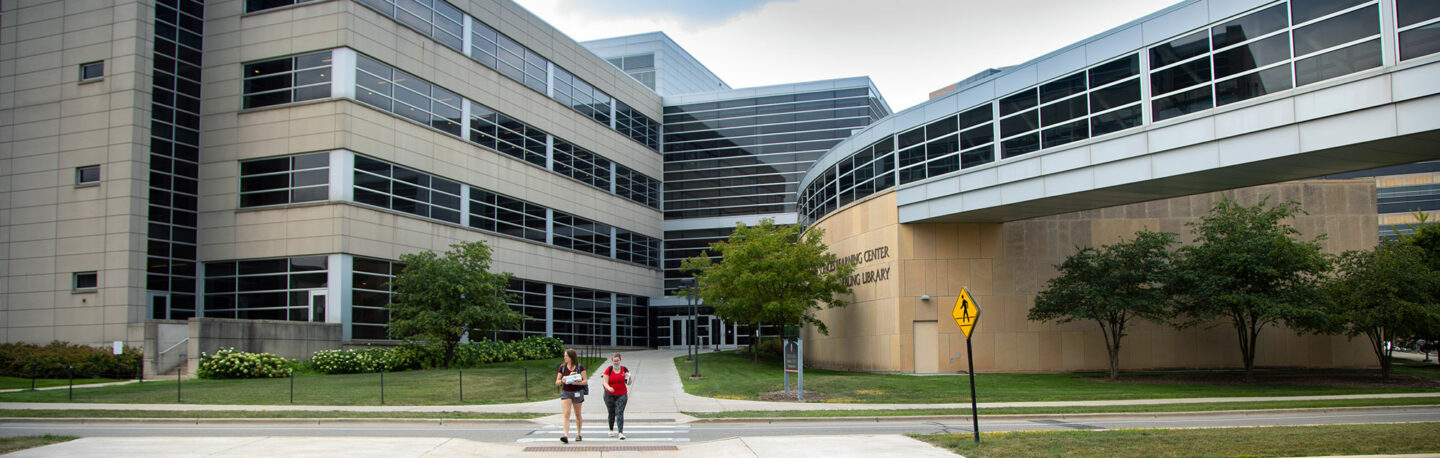 People walking on the medical campus on a warm day