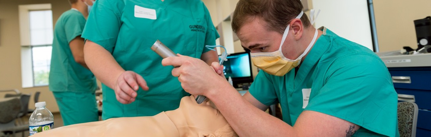 WARM student practices intubating a patient in a simulation lab