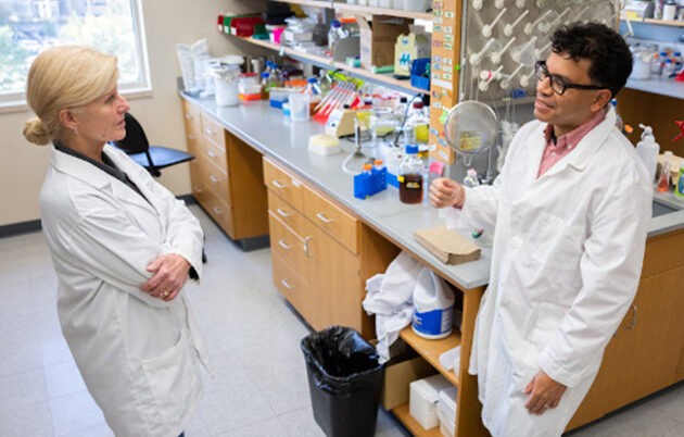 Two scientists in discussion