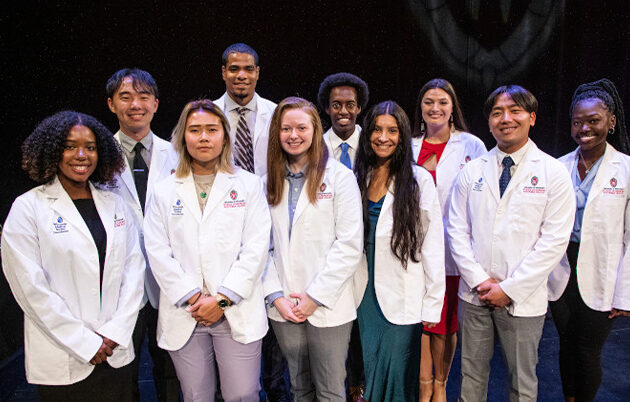Nia Foster and fellow first-year students at the white coat ceremony