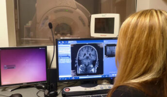 Sara John, MRI research technologist, looking at brain images