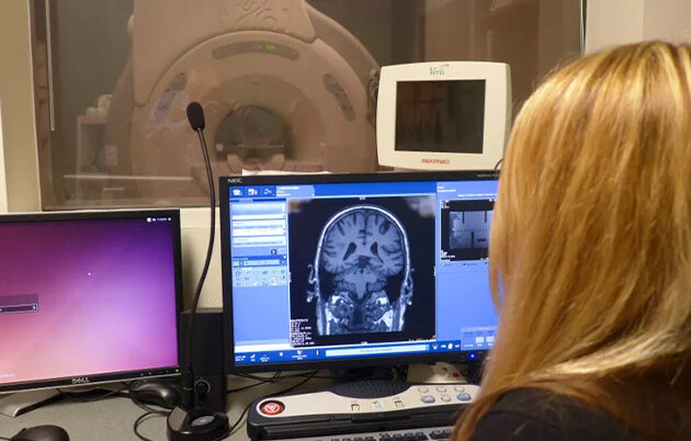 Sara John, MRI research technologist, looking at brain images