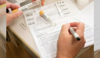 A person reviewing clinical trials consent forms