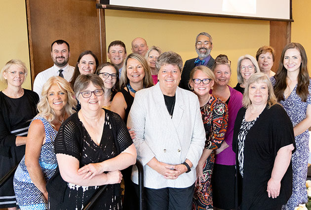 PA program staff smiling in a group