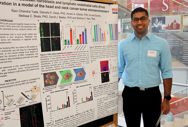 MSTP student with research poster