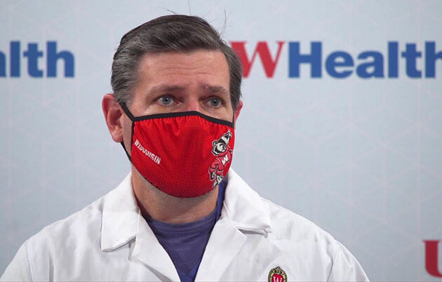 A masked Badger health care professional in an interview