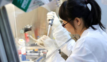 A researcher working diligently in a lab