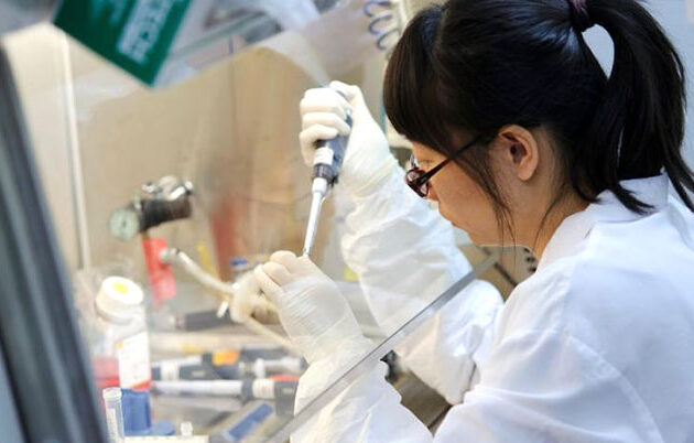 A researcher working diligently in a lab