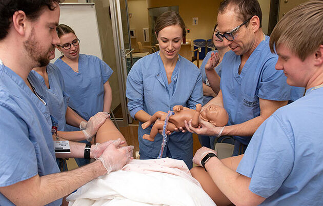 Rural medicine students practice delivering babies in a simulation lab in La Crosse, Wisconsin