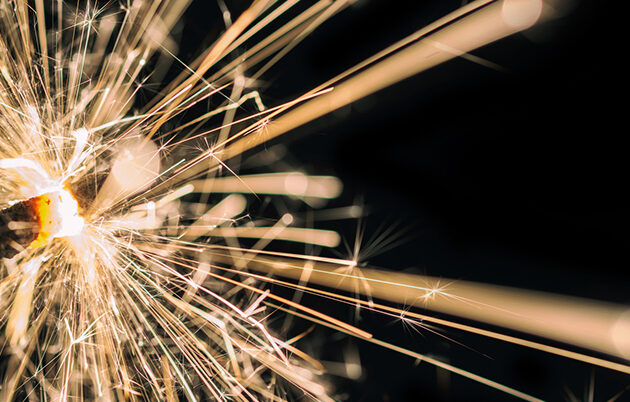 Close up of a lit sparkler at night