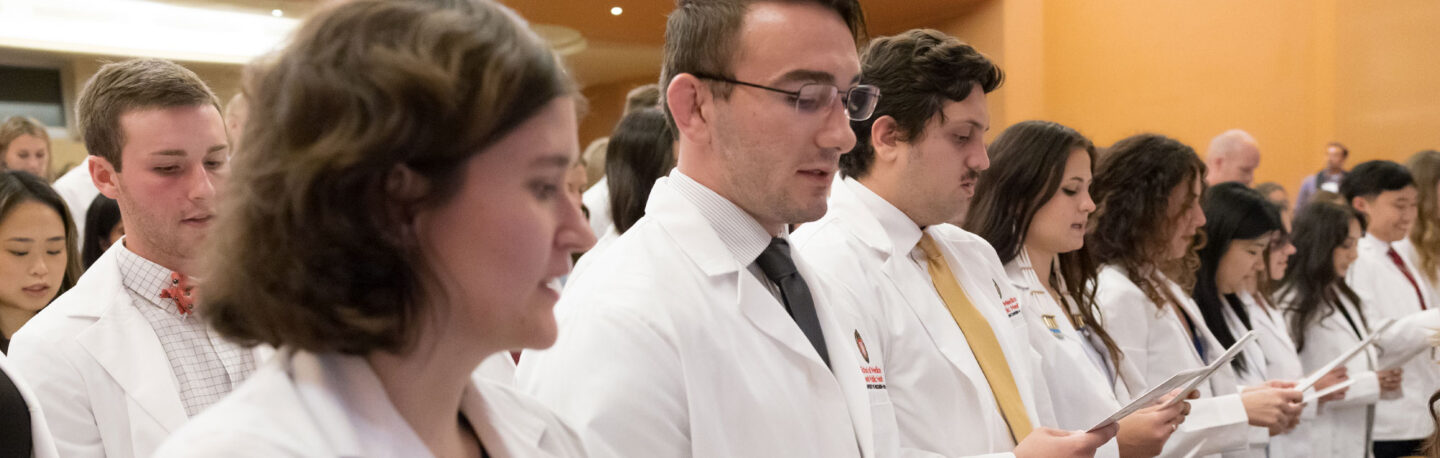 Students at the white coat ceremony read the Declaration of Geneva