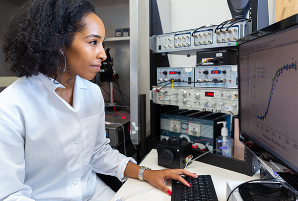 Neuroscientist working at a computer