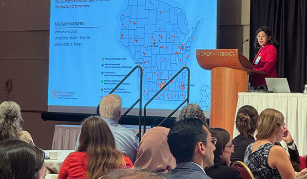 Dean Ahuja presenting a slide about the MD program's Statewide Campus