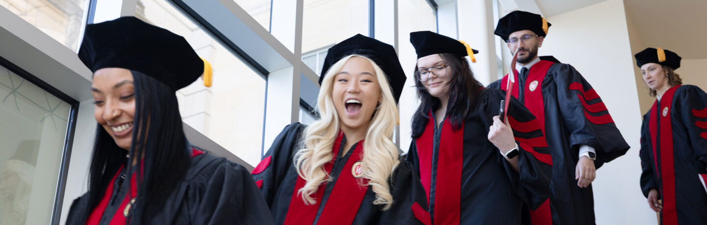 2026 MD graduates on the stairs inside the UW Memorial Union