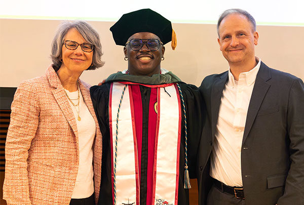 Sue Wenker, graduate Ide Ikhumhen and Jeff Hartmann