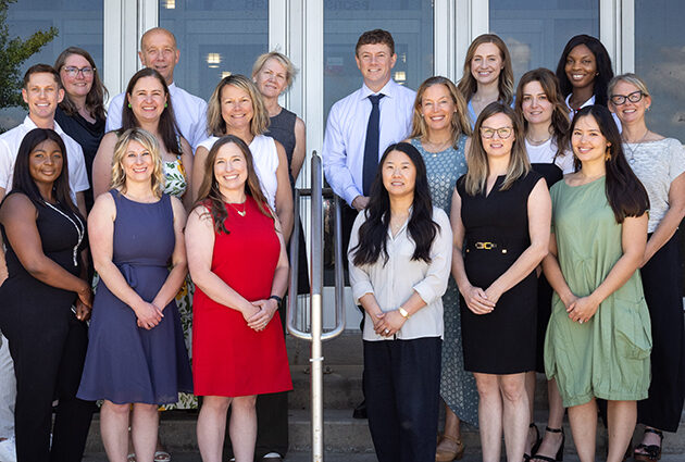 PA program staff smiling in a group