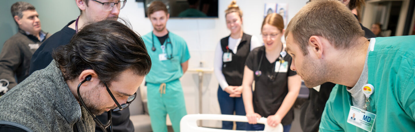 Doctors gathered around a patient bed
