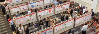 A crowd engaging in a poster session