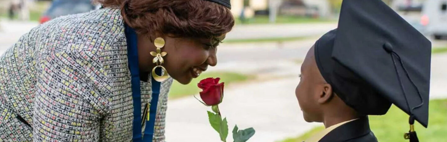 A graduate having a meaningful moment with her son