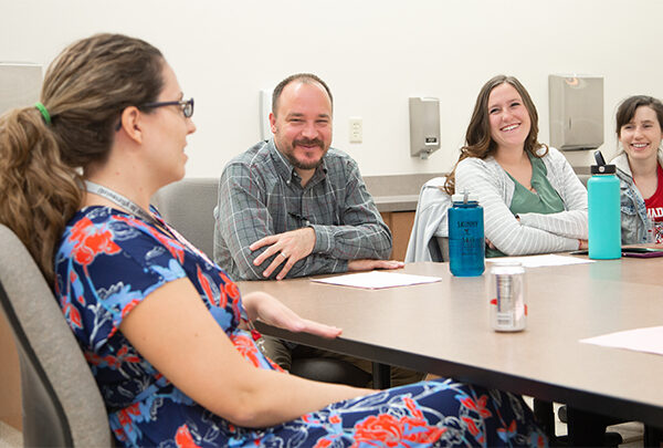 A group of staff having an upbeat discussion