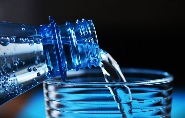 water bottle pouring into a glass