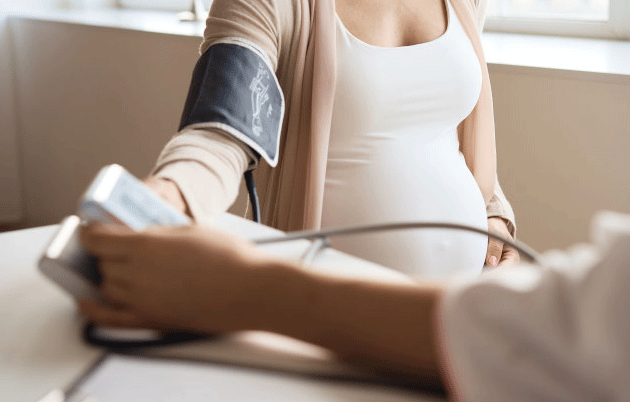Pregnant woman checking BP