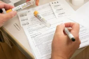 person reviewing clinical trials consent forms