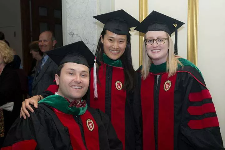 Three medical students at graduation
